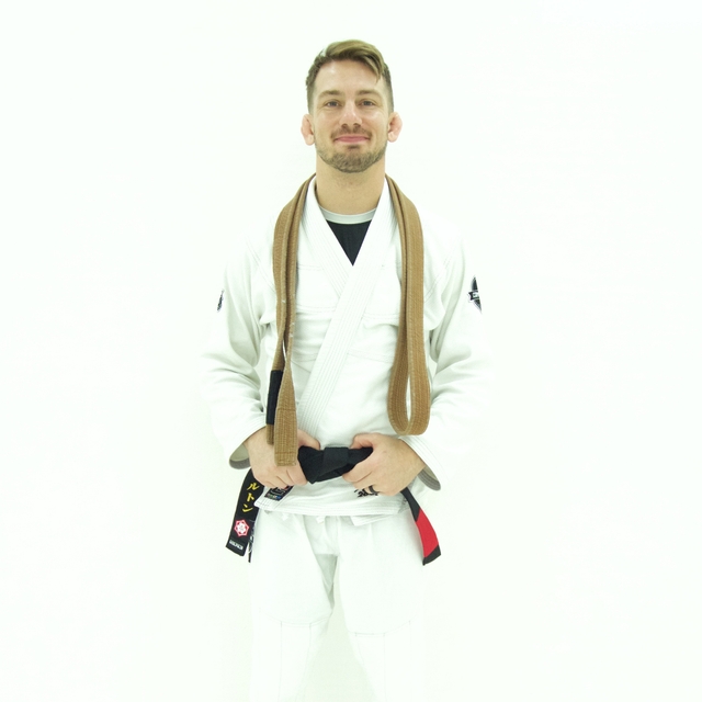 Coach Justen Hamilton gets promoted to black belt in Brazilian Jiu-Jitsu